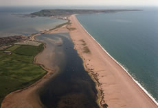 Aerial image of Chesil Beach Chesil Bank, 29 km long shingle beach, a  tombolo connecting mainland to the Isle of Portland, Jurassic Coast, UNESCO  Worl - SuperStock